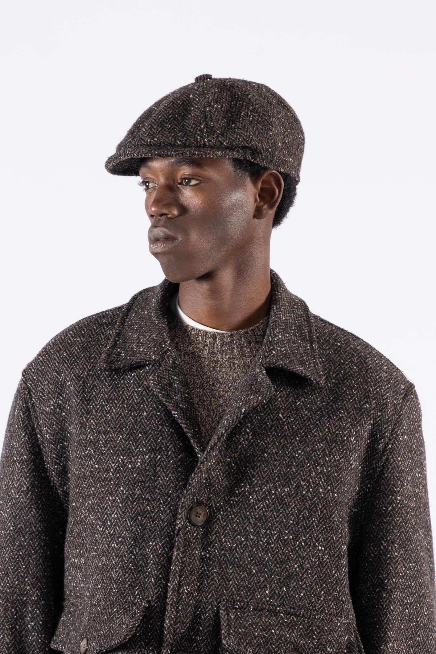 Coppola in lana motivo spigato