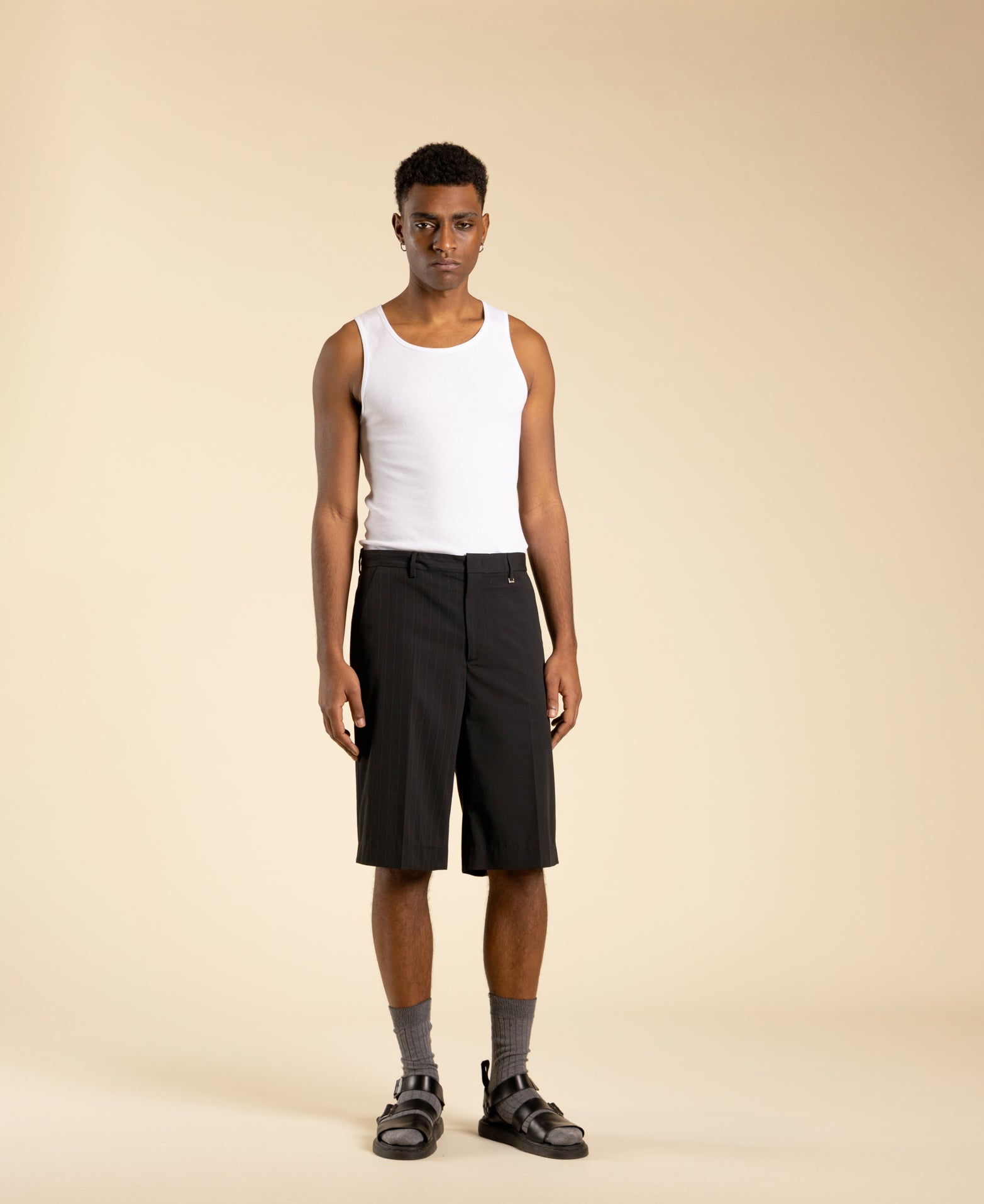 Wide, half-pinstriped Bermuda shorts in polyviscose