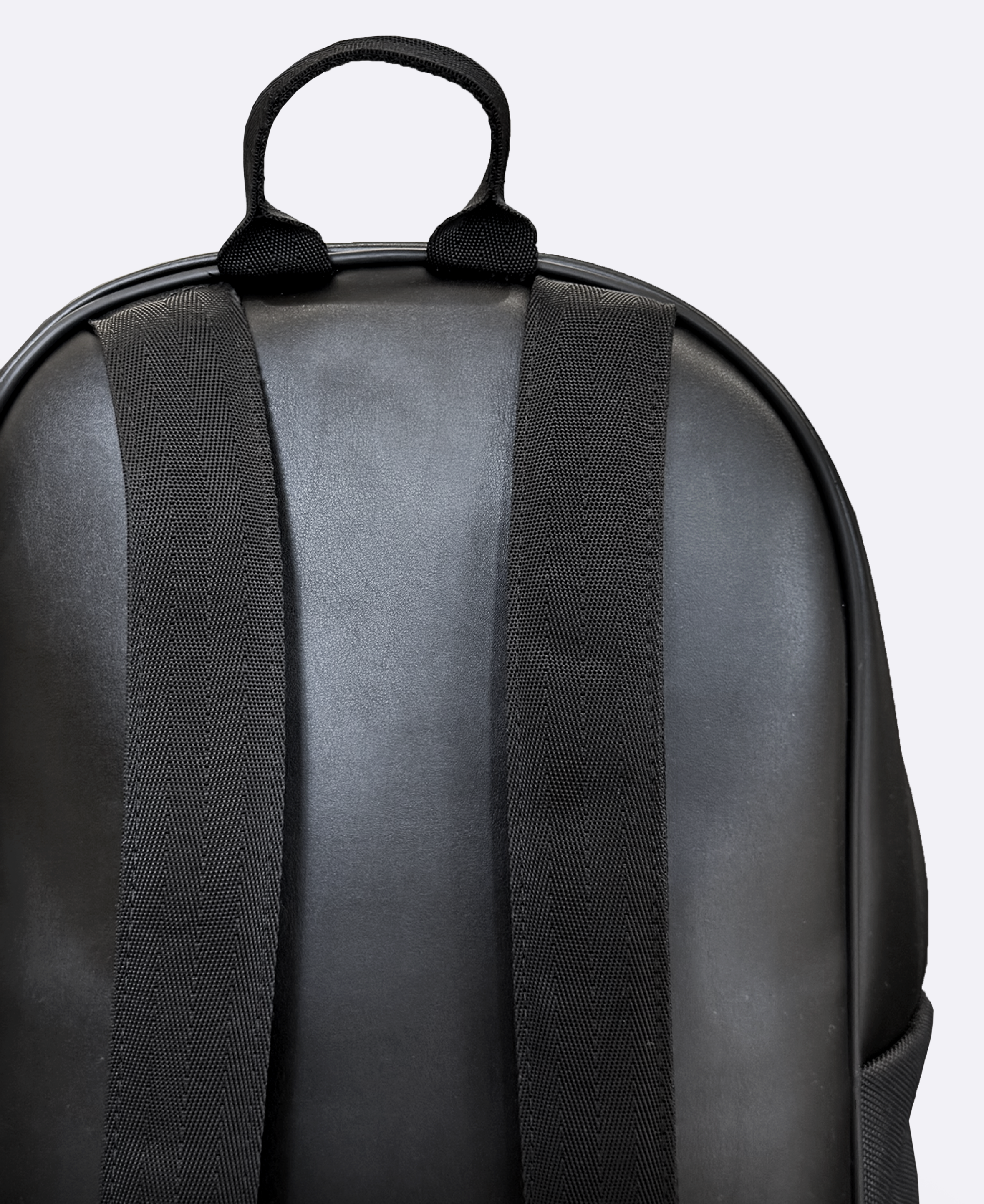 Eco-leather backpack with matt black metal logo