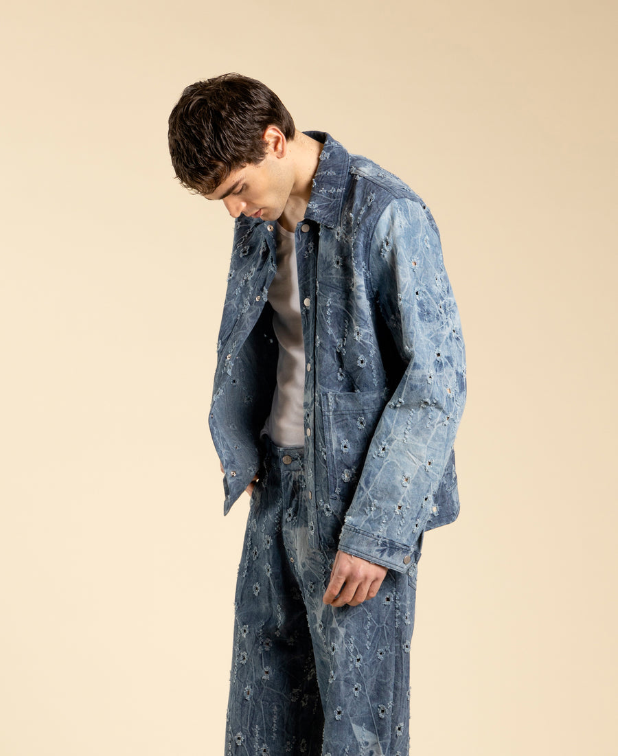 Giacca in denim blu con rotture