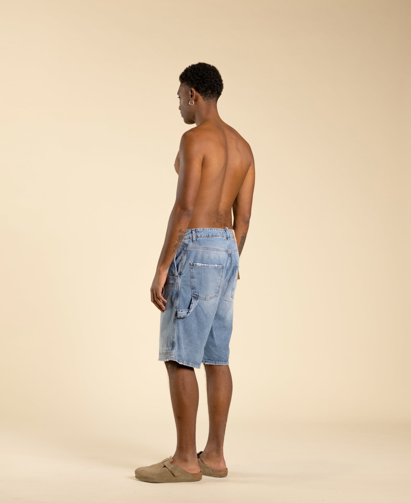 Wide carpenter Bermuda shorts with a faded effect