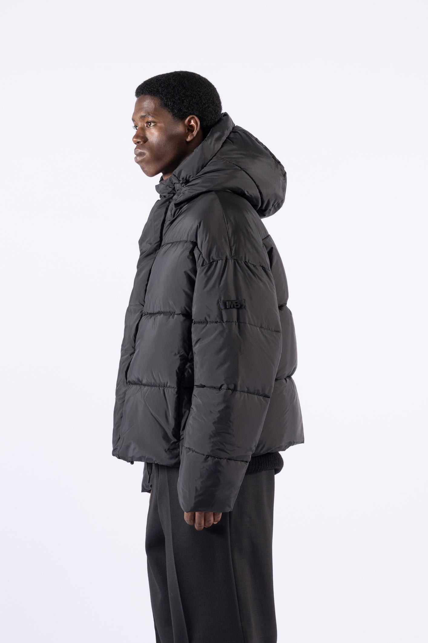 Piumino oversize con cappuccio - Nero