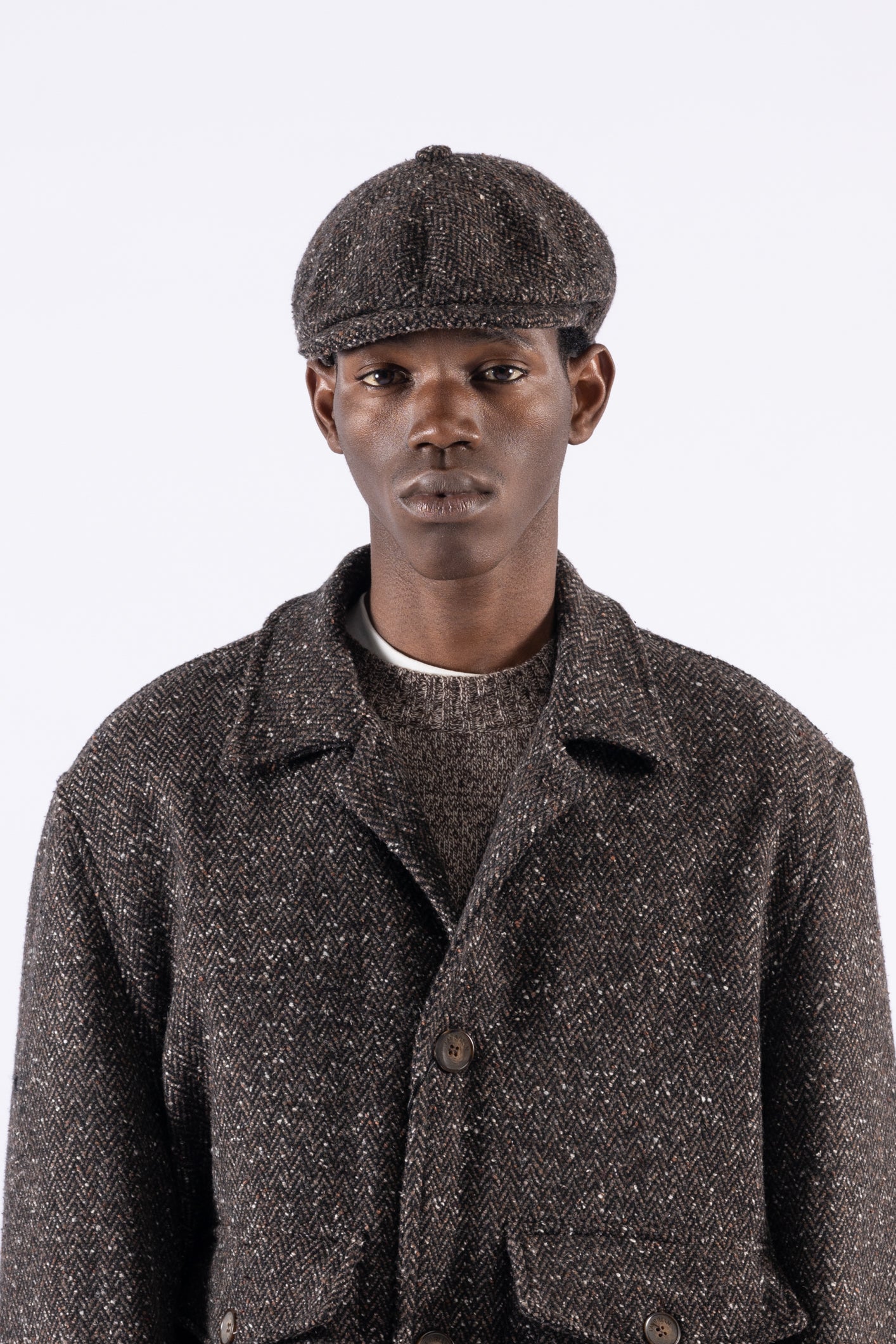 Coppola in lana motivo spigato