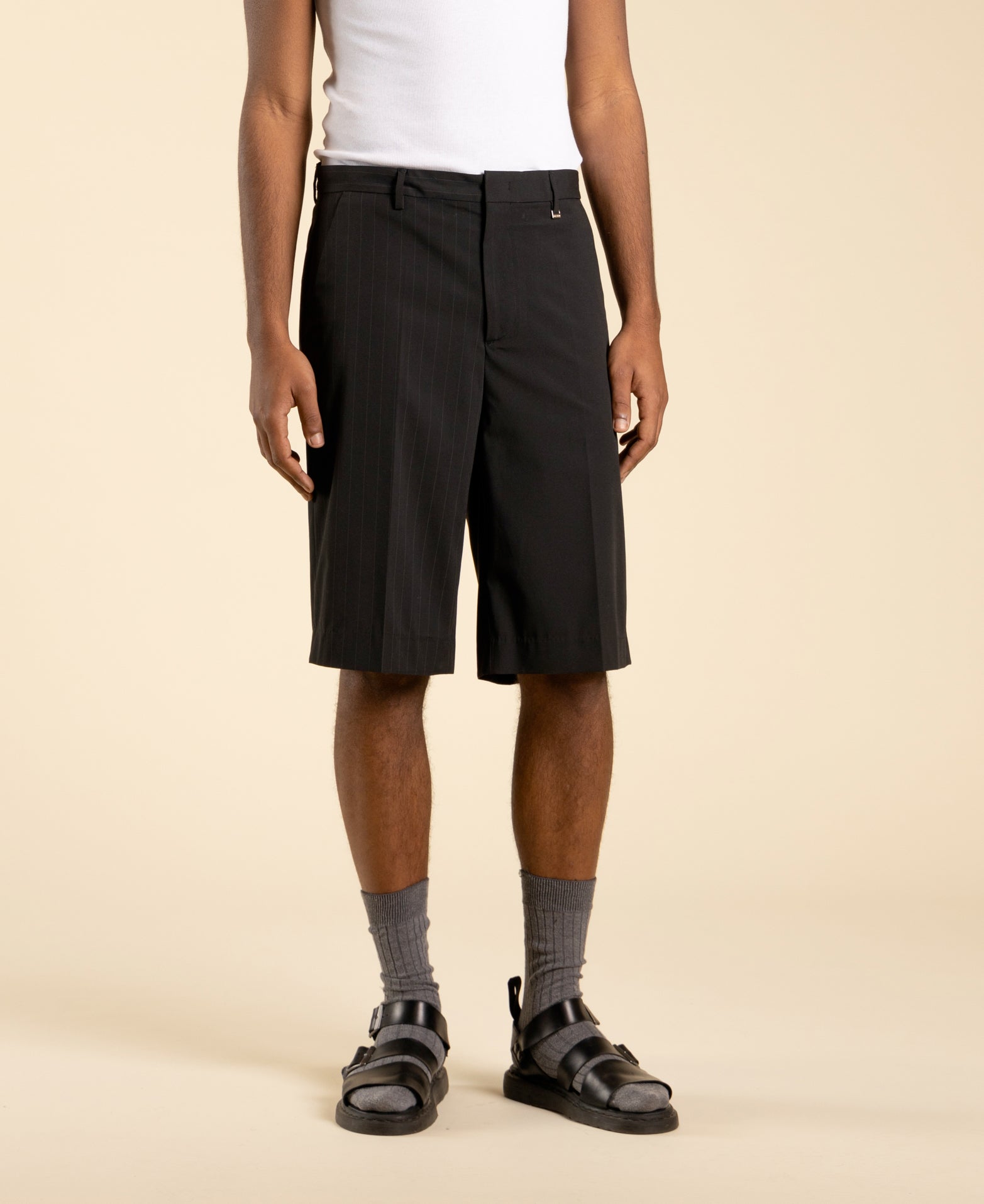 Wide, half-pinstriped Bermuda shorts in polyviscose